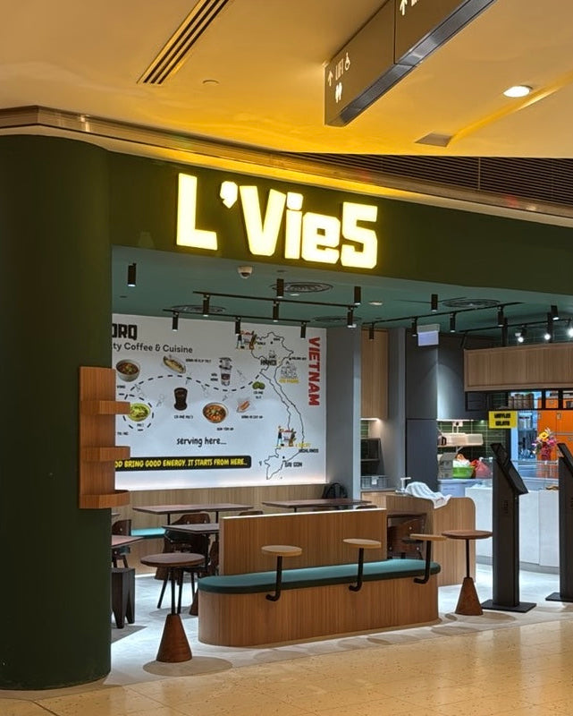 The image shows L'Vie5 Vietnamese specialty cafe exterior at One Raffles Quay