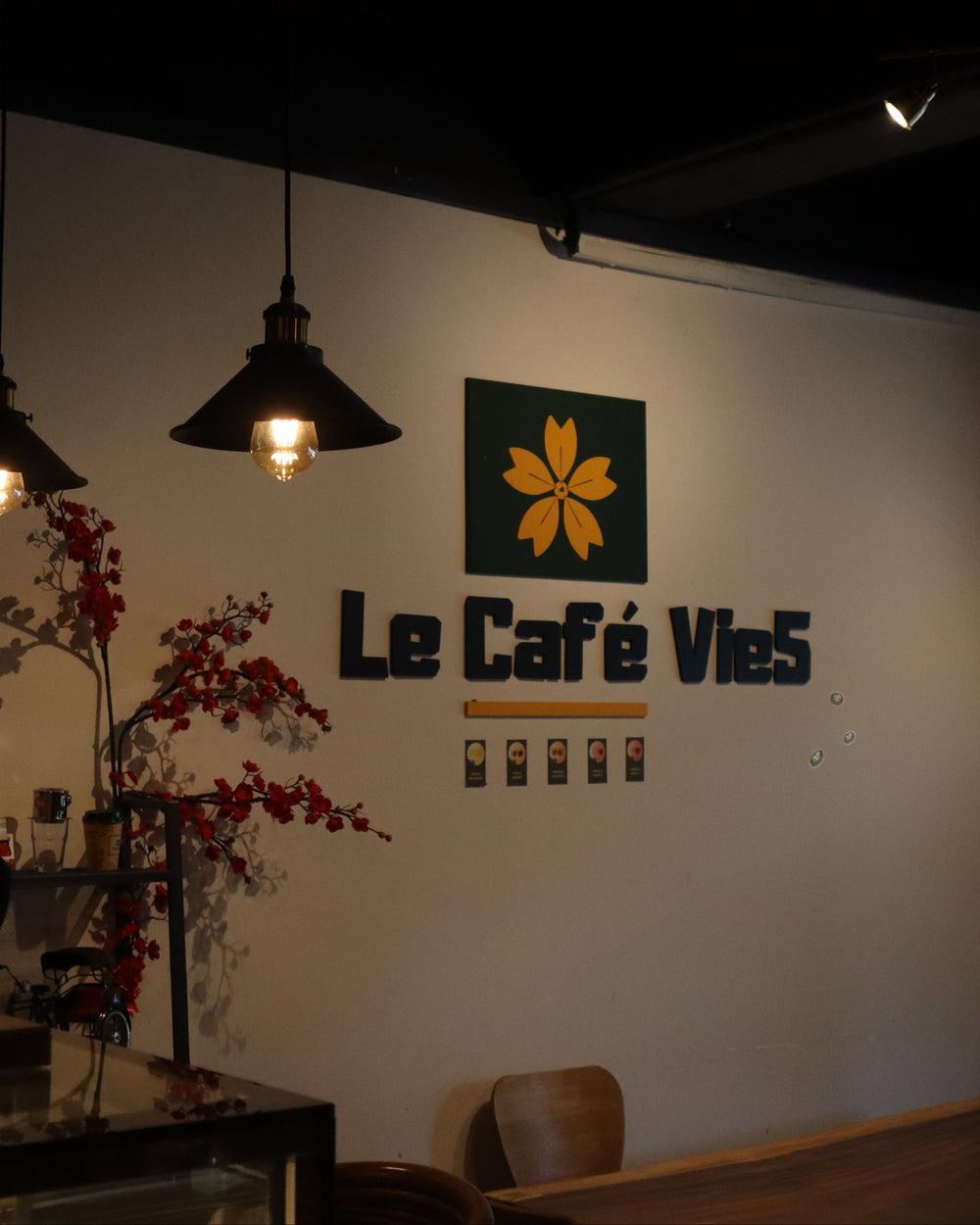 The image shows the inside of Le Cafe Vie5 at Tai Seng, Upper Paya Lebar Road with the logo and cozy wooden interior